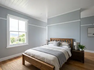 Bedroom with a freshly painted white VJ ceiling and pale blue walls